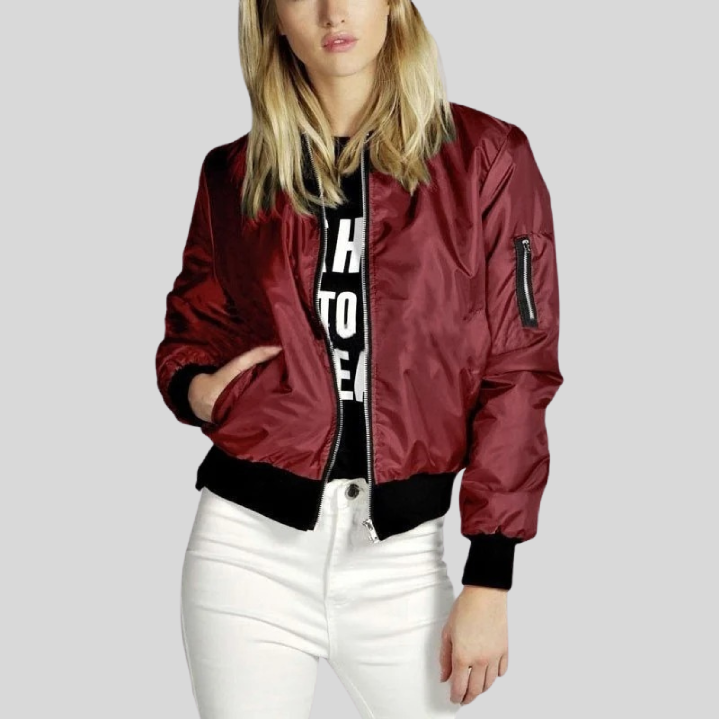 Women's red zip-up bomber jacket with ribbed cuffs, waistband, and zip pocket