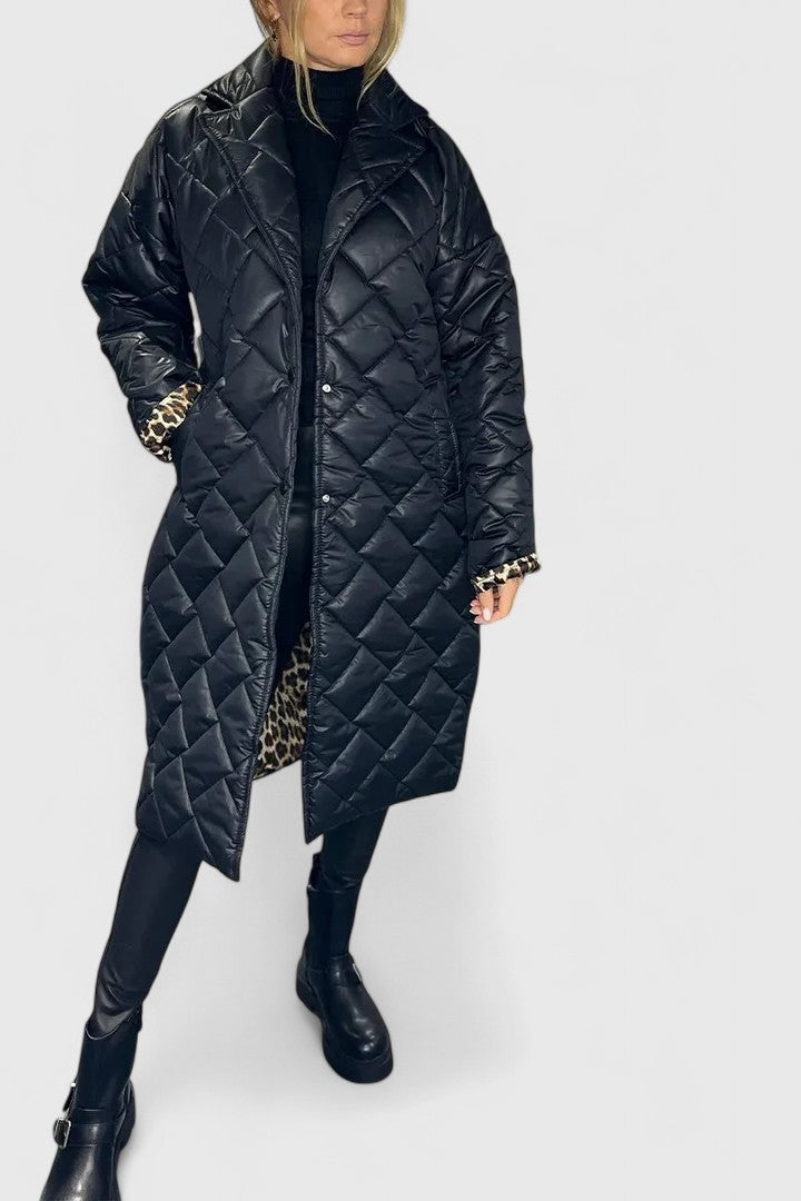 Long black quilted coat with notch collar and button-front, side pockets