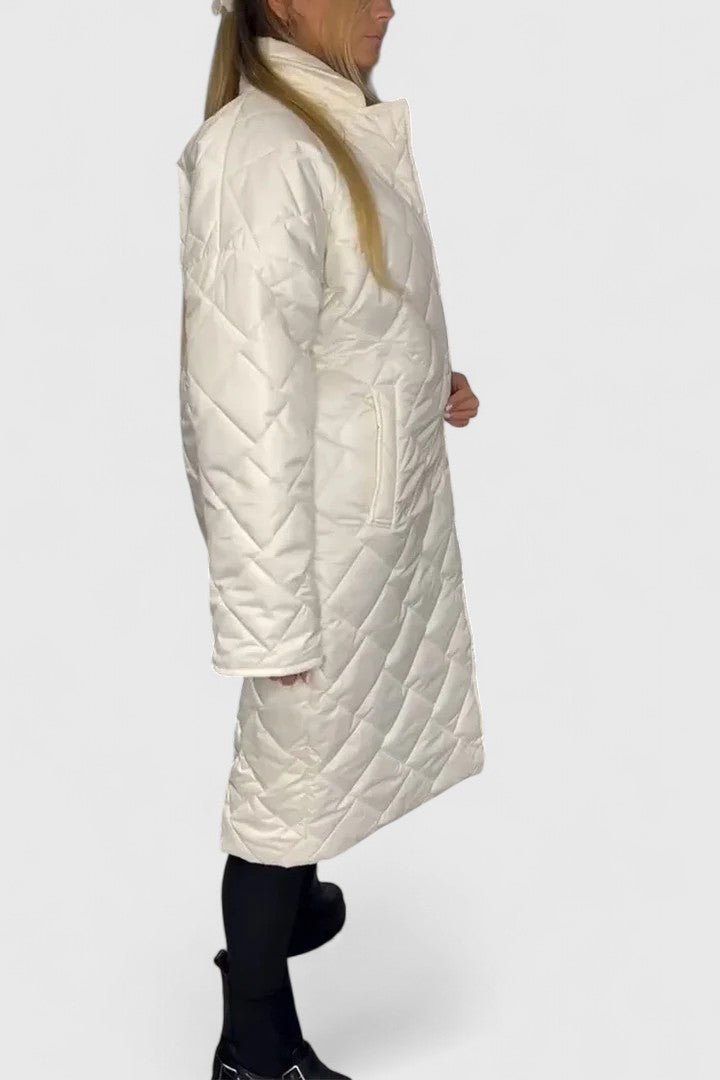 Long white quilted coat with button front and high neck, side pockets
