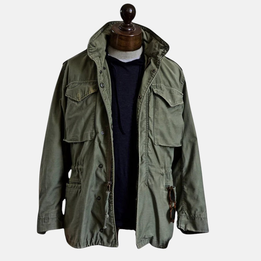 Green field jacket with four-button front and flap chest pockets