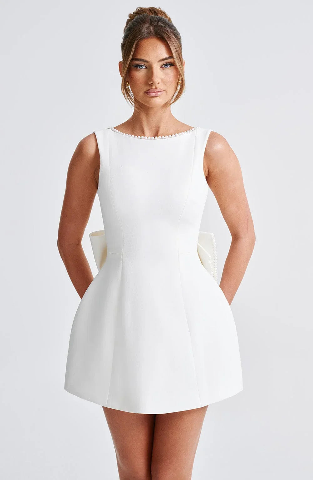 Sleeveless occasion mini dress in white with pearl-trim neckline