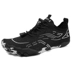 Black low-top lace-up barefoot shoes with flexible tread sole and textured upper.