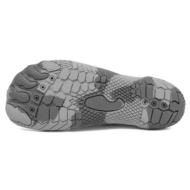 Gray outsole view of low-top barefoot shoes with deep traction tread and grip texture.