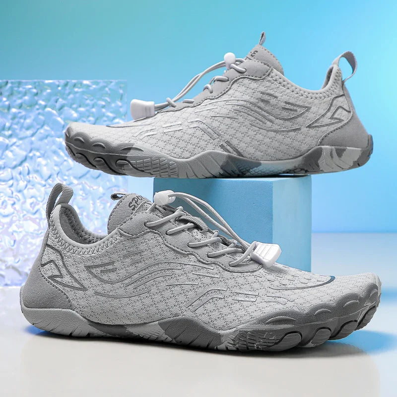 Light gray low-top lace-up barefoot shoes with flexible traction sole and knit upper.