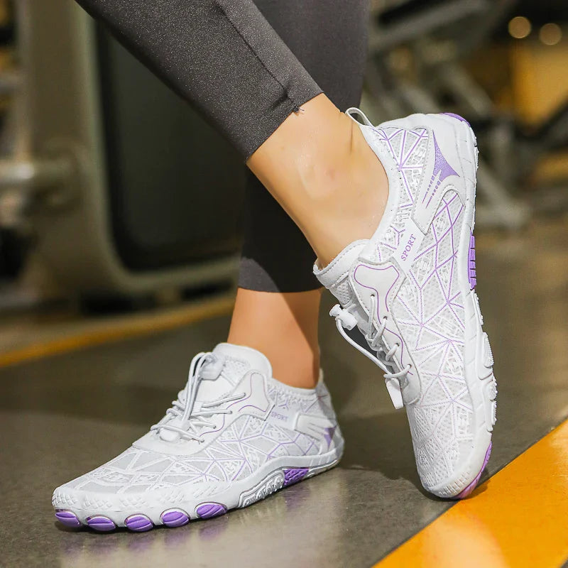 White waterproof barefoot sneakers with purple trim and textured tread sole