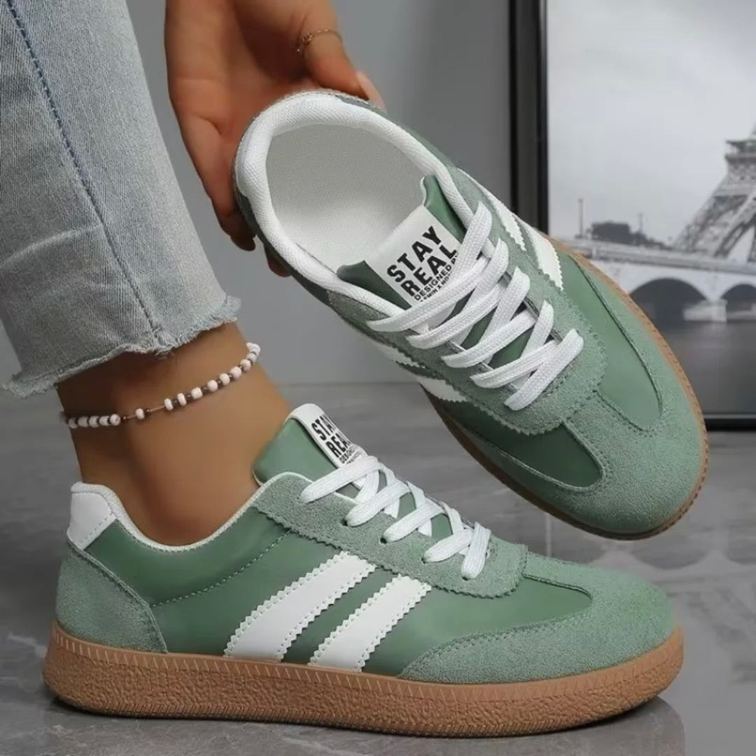 Women’s comfort lace-up sneakers in green with white laces and gum sole