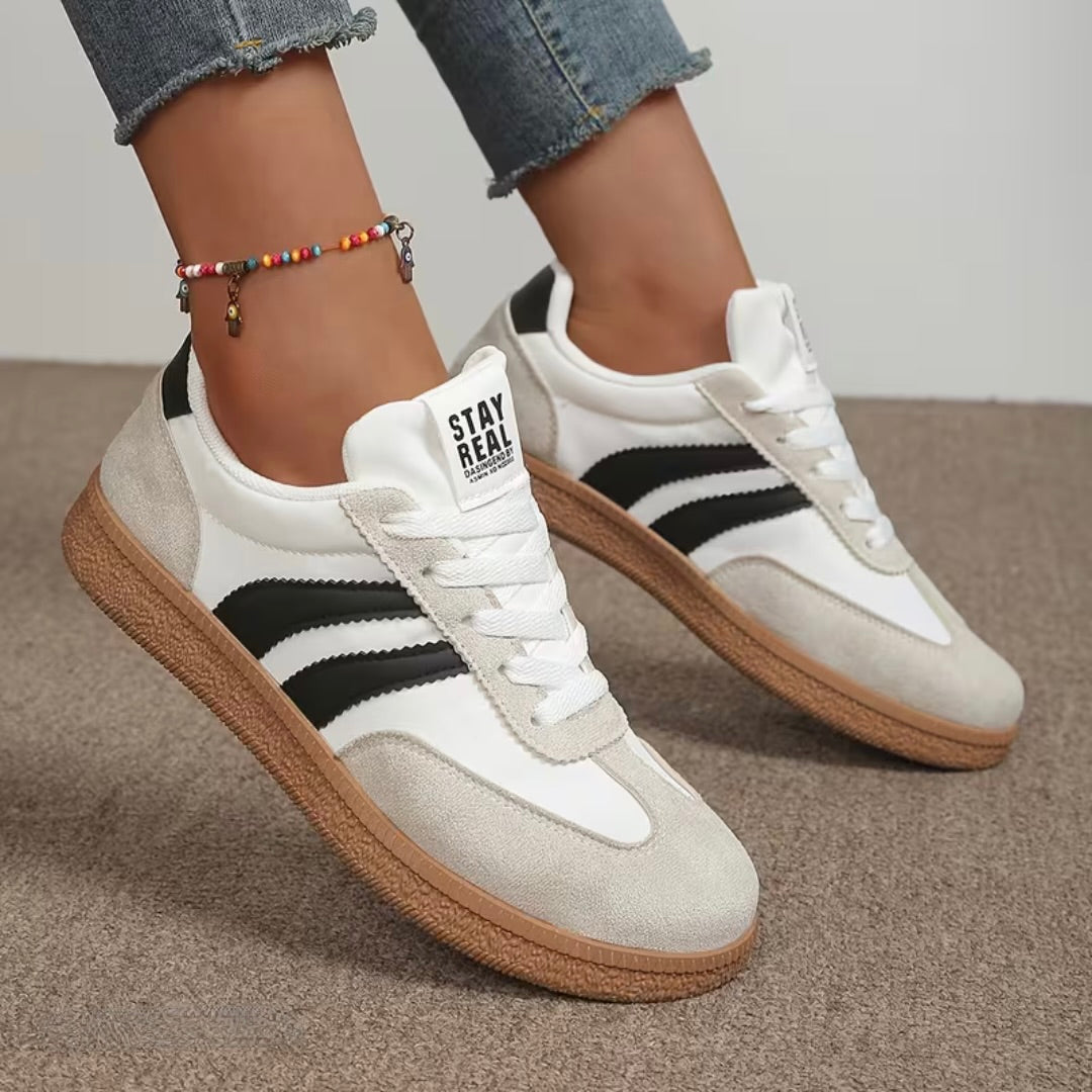 Women’s comfort lace-up sneakers in white with light gray suede panels and gum sole