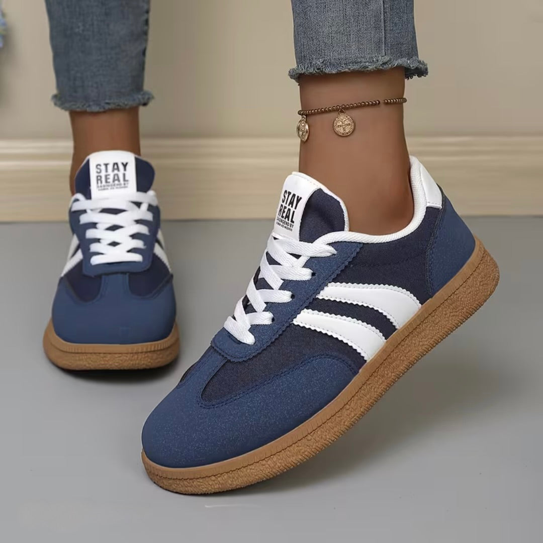 Women’s comfort lace-up sneakers in navy blue with white stripes and gum sole