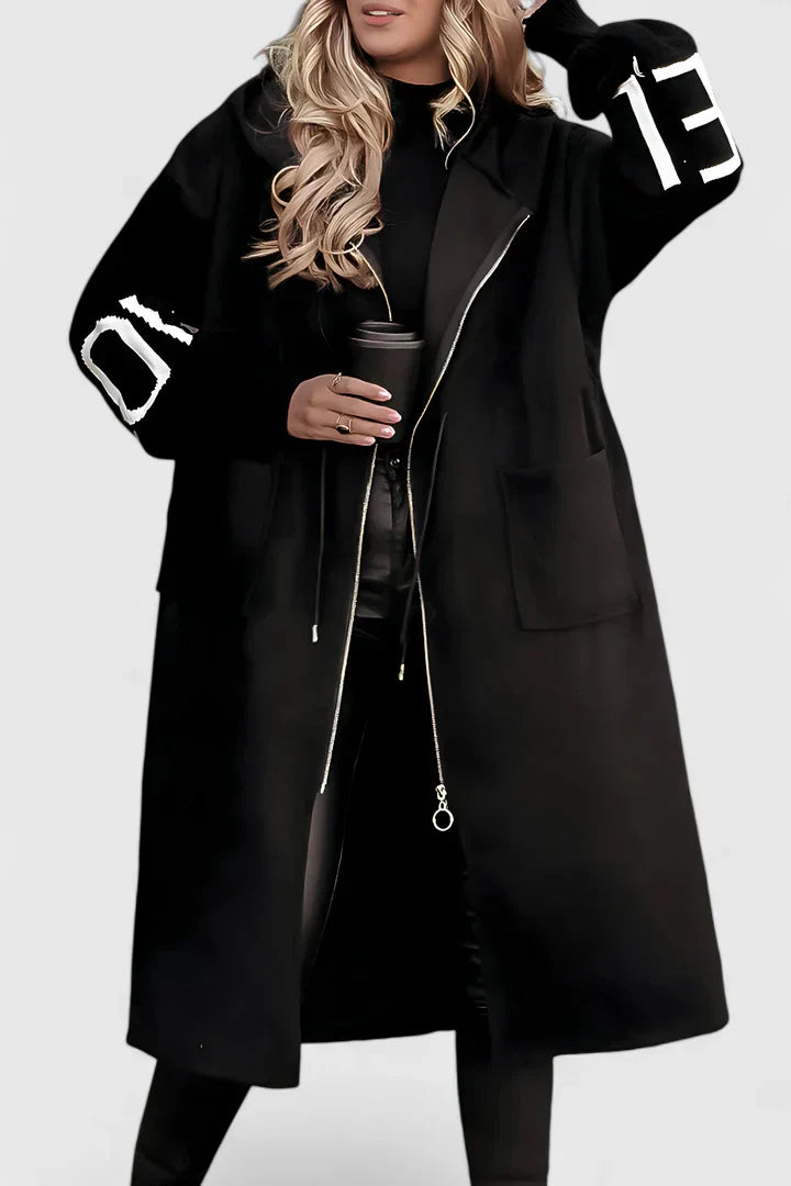 Black hooded long coat with front zip, drawstring, patch pockets, and graphic sleeve accents.