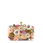 Floral embellished vegan leather clutch bag with gold-tone frame and handle rings