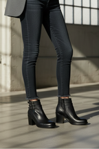 Black strappy ankle-strap block-heel boots with strap detail and chunky heel