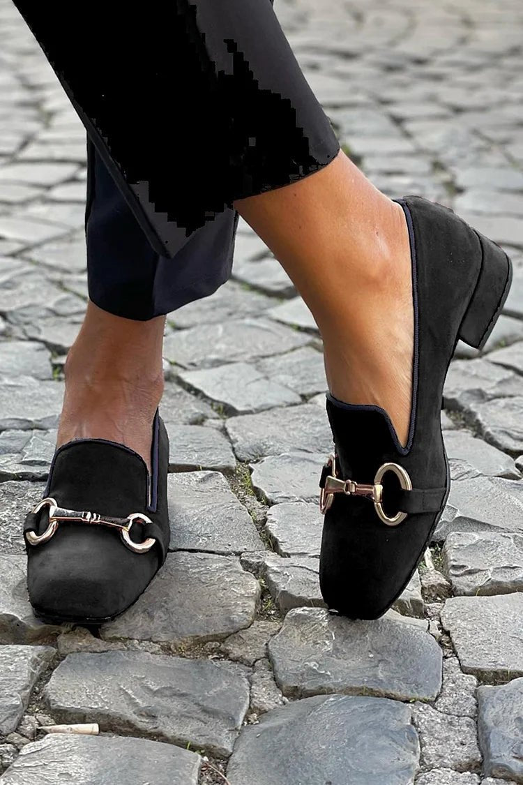 Women's black suede loafers with golden horsebit detail, rounded toe