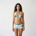 White floral triangle bikini set with halter top and drawstring swim shorts