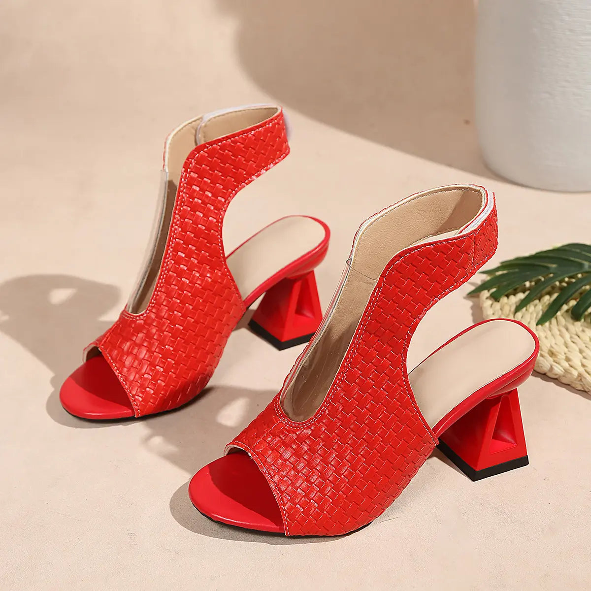 Red woven open-toe block heel sandals with ankle cutout strap