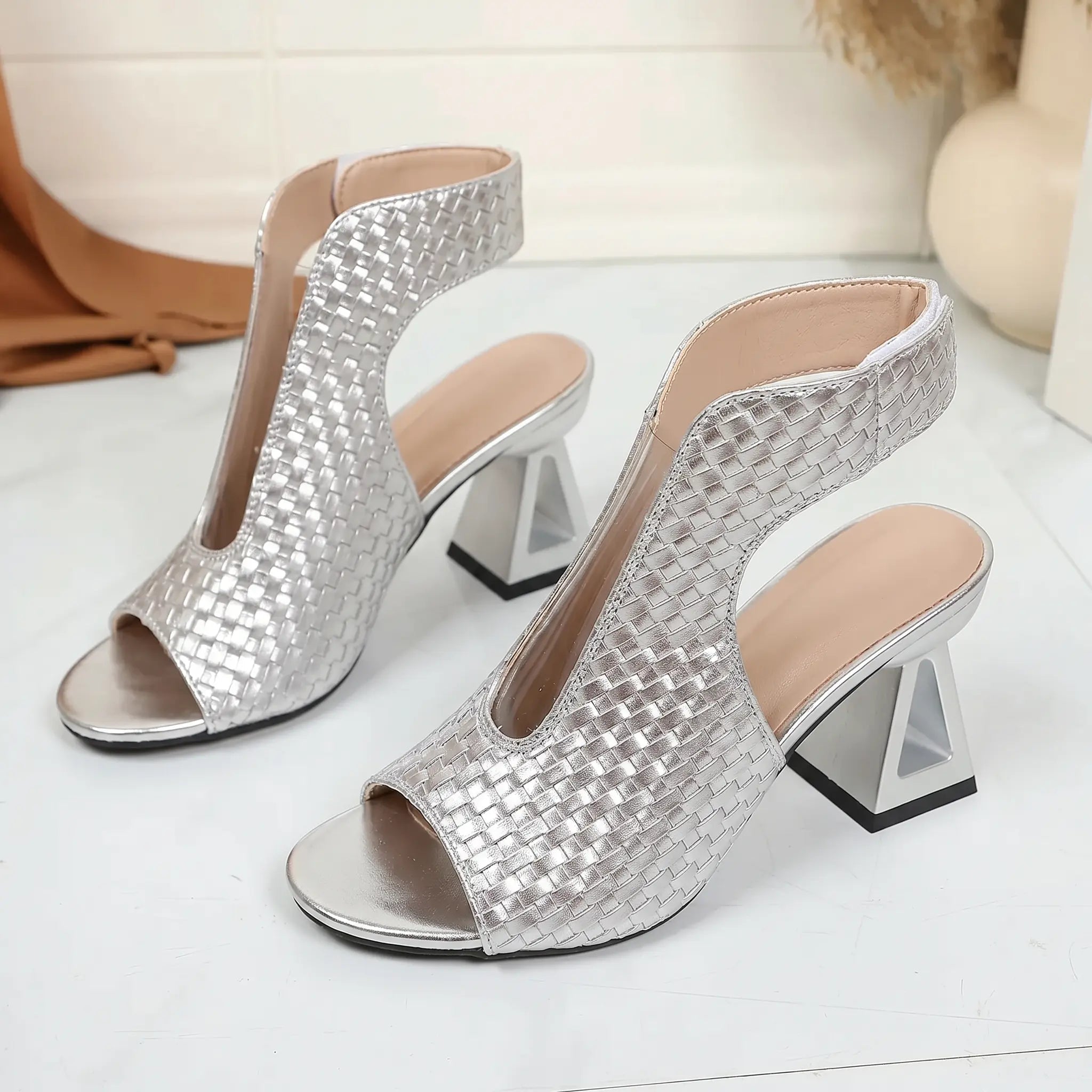 Silver woven open-toe block heel sandals, sculptural tall heel, ankle-high upper