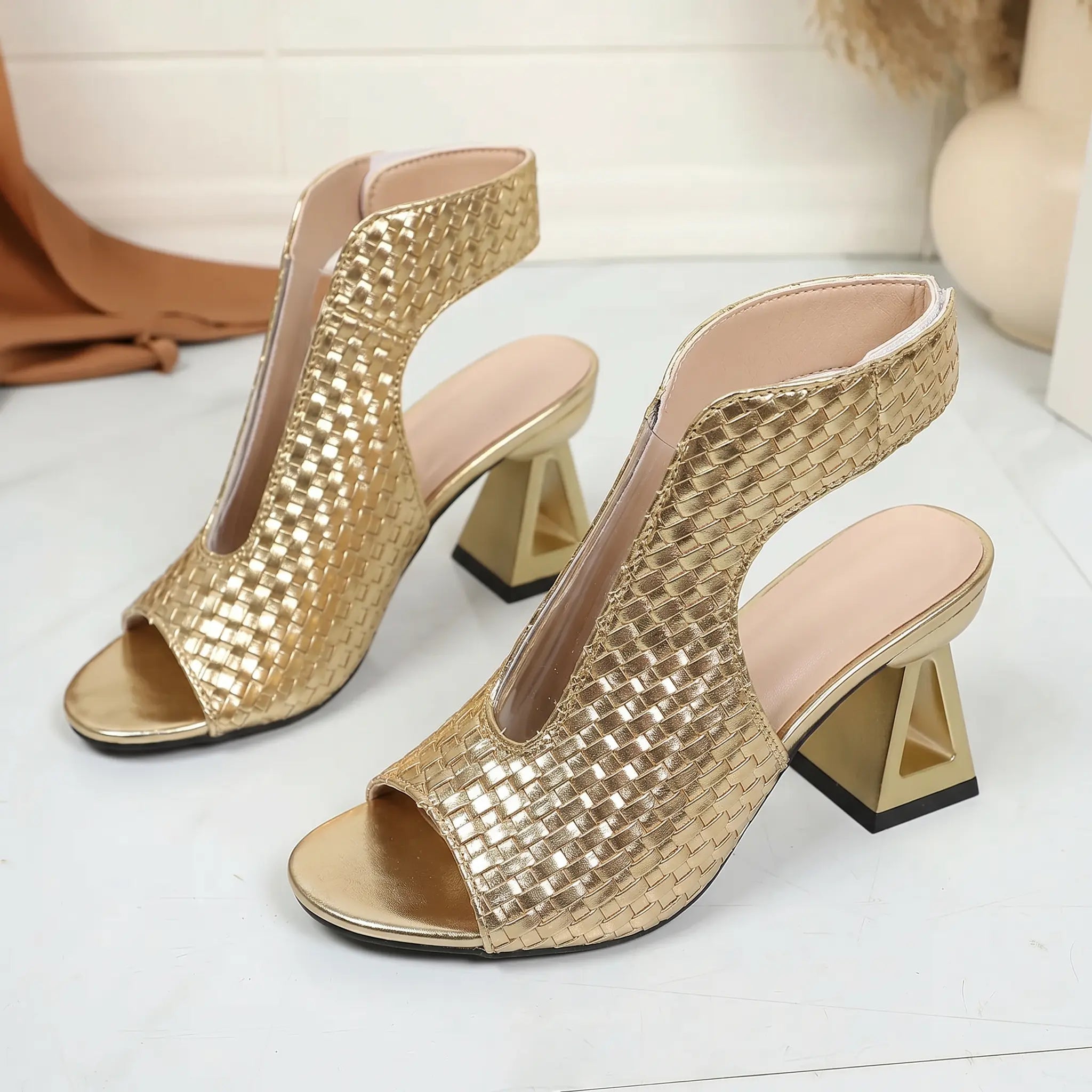 Gold metallic woven open-toe block heel sandals with ankle strap