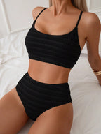 Black smocked texture high-waist bikini set with wireless crop top and spaghetti straps