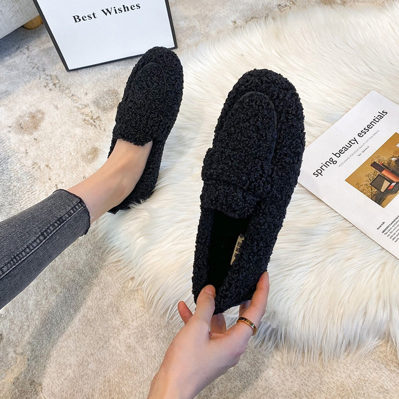 Women’s black fleece teddy slip-on slippers with cushioned sole