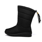 Black mid-calf winter boots with quilted panels, tassel pull, and grippy rubber sole
