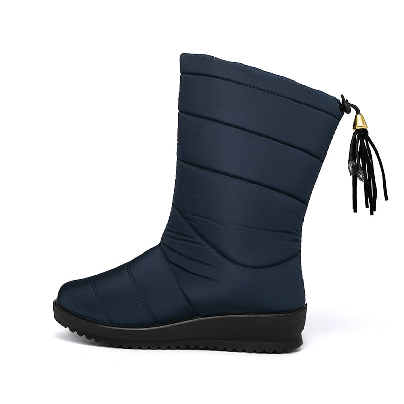 Navy mid-calf winter boots with quilted bands, tassel pull, and treaded rubber sole