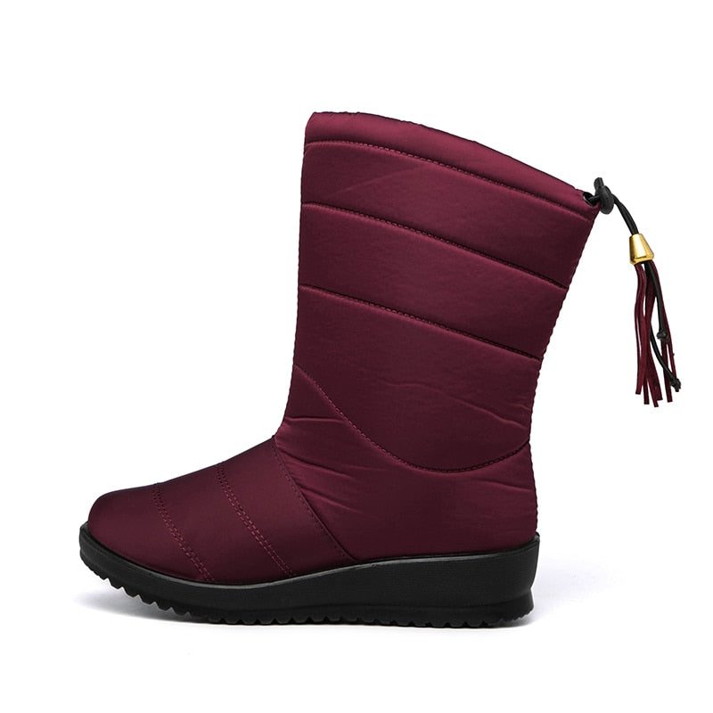 Burgundy mid-calf winter boots with quilted bands, tassel pull, and treaded rubber sole