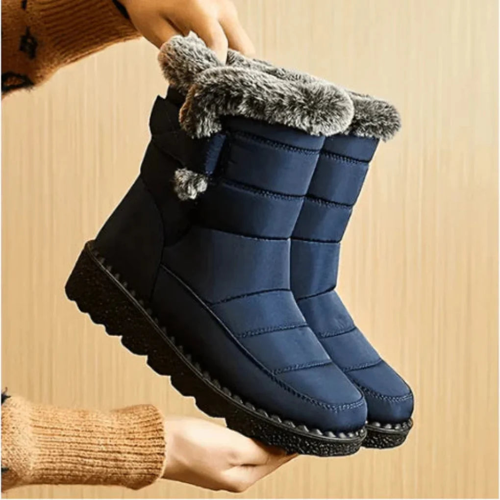 Women’s waterproof snow boots, dark blue with grey faux-fur cuffs and thick tread soles