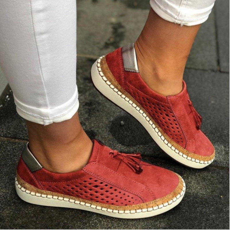 Women's slip-on walking shoes, red perforated uppers with tassel detail