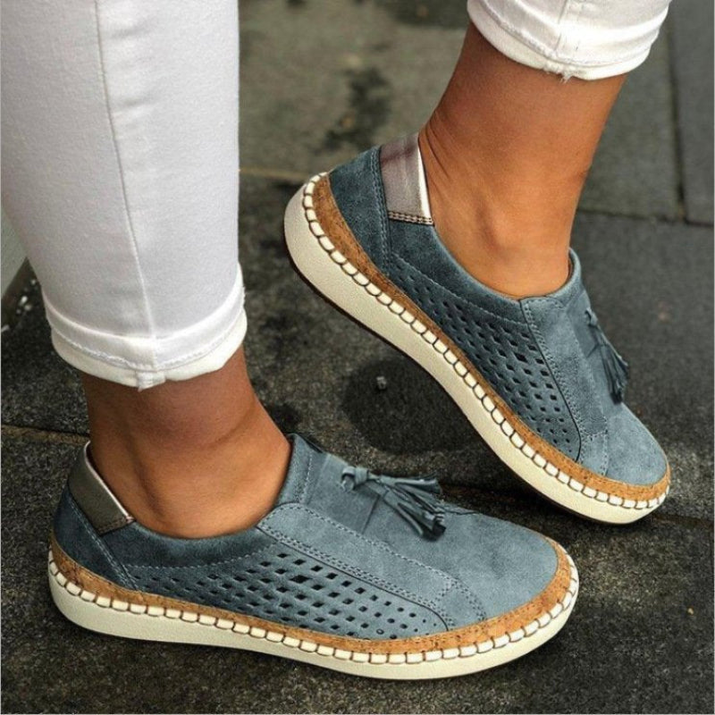 Women's slip-on walking shoes, blue perforated uppers with tassel detail