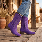 Women's purple western cowboy boots with mid heel, embroidered pull-on style, side view