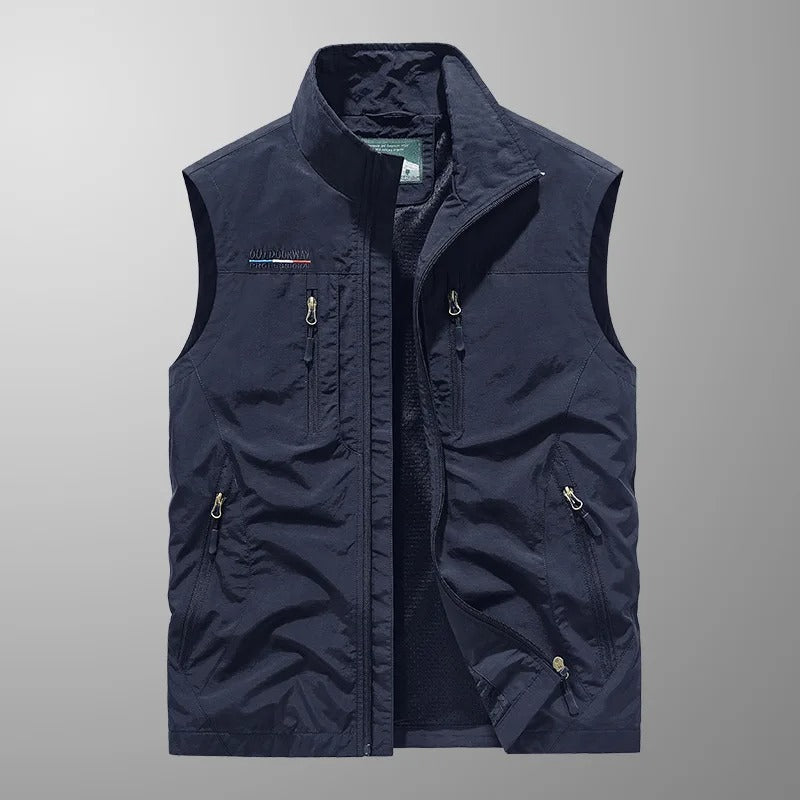 Navy sleeveless cargo vest with full-zip front and multiple flap pockets