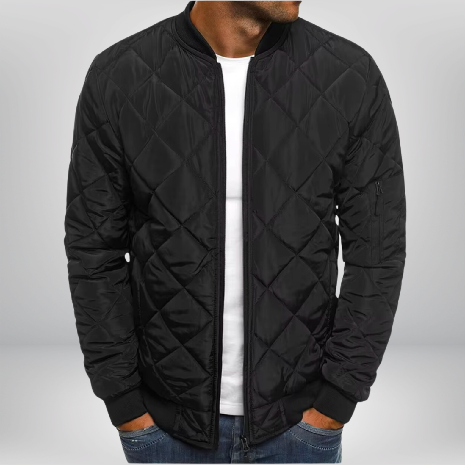 Black quilted bomber jacket with front zip, ribbed collar/cuffs, diamond quilting