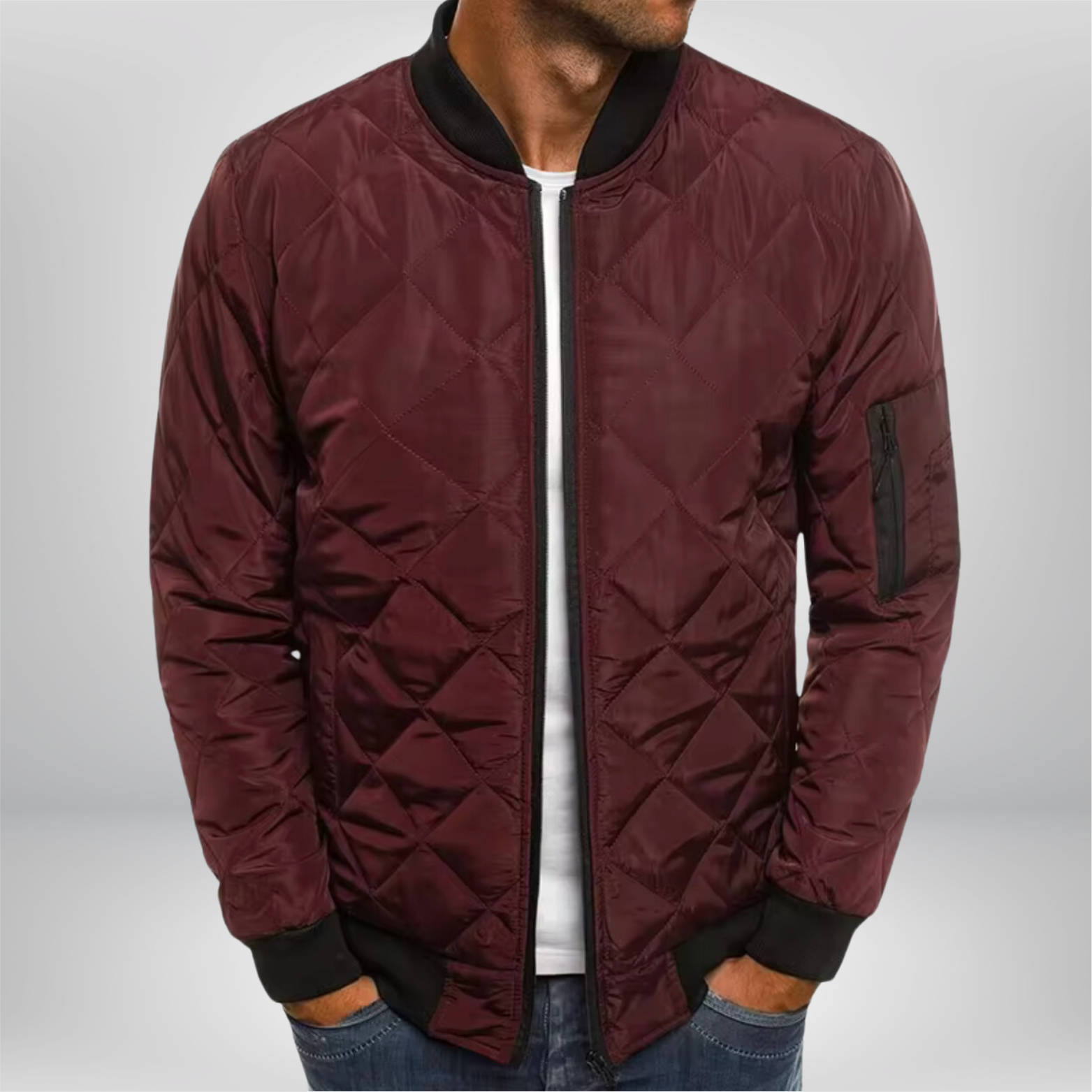 Burgundy quilted bomber jacket with front zip, ribbed collar/cuffs, diamond quilting