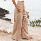 High-waisted linen wide-leg trousers with elastic smocked waistband, beige tan