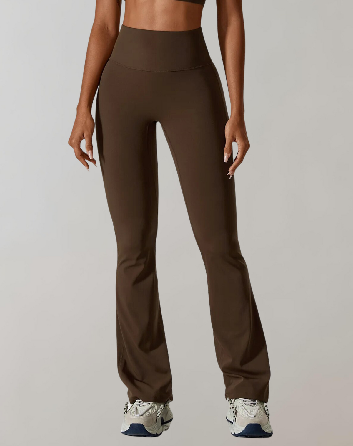 Brown high-waisted wide-leg yoga pants with smooth waistband and wide flared legs