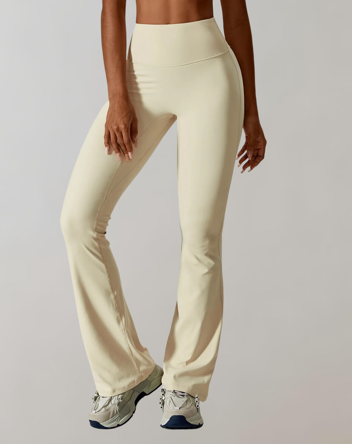 Cream high-waisted wide-leg yoga pants with smooth waistband and flared wide legs