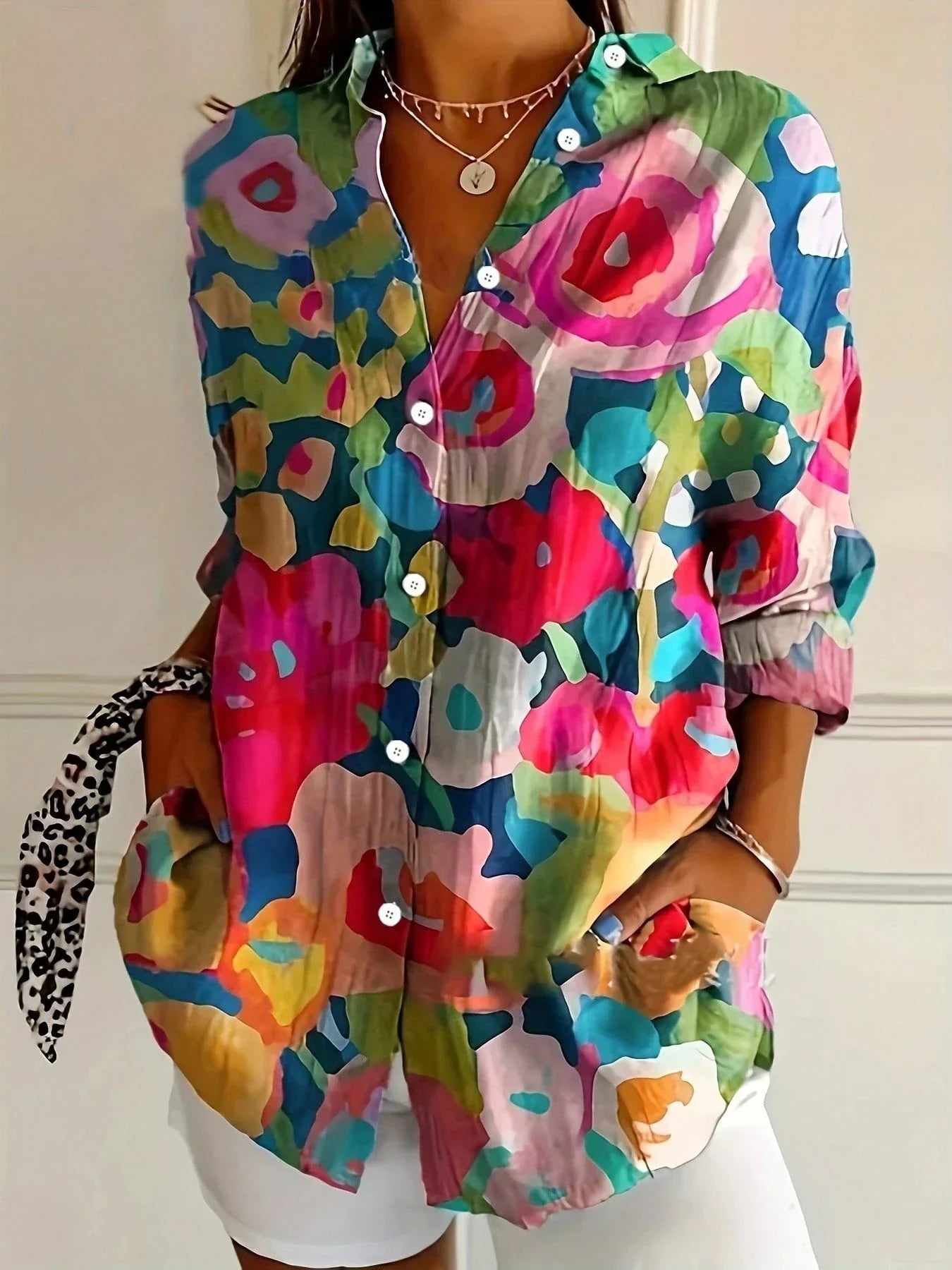 Bright multicolor abstract button-up blouse with collared neck, long sleeves, front buttons