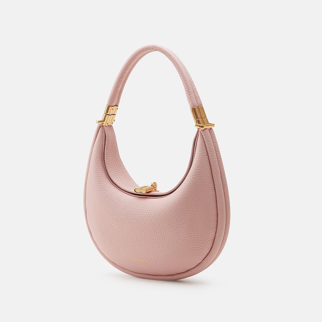 Women's pink full-grain leather crossbody bag with curved opening and gold-tone clasp