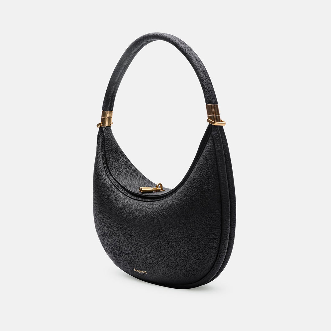 Women's black full-grain leather crossbody bag with curved opening and gold-tone clasp