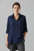 Blue women’s blouse with collar and button front, three-quarter sleeves.