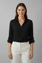 Black women’s blouse with collar and button front, rolled three-quarter sleeves.