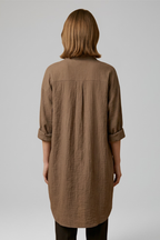 Brown women’s blouse, back view with yoke seam and buttoned cuffs, three-quarter sleeves.