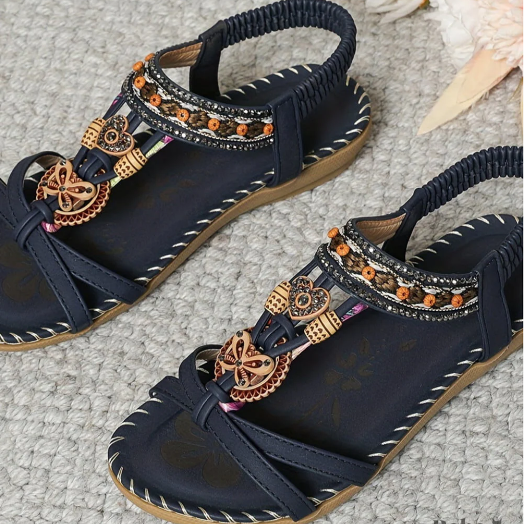 Navy beaded flat sandals with braided-look toe straps and gold-toned ornament details