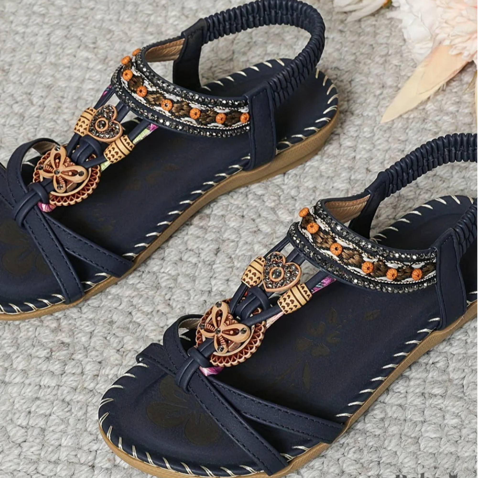 Navy beaded flat sandals with braided-look toe straps and gold-toned ornament details