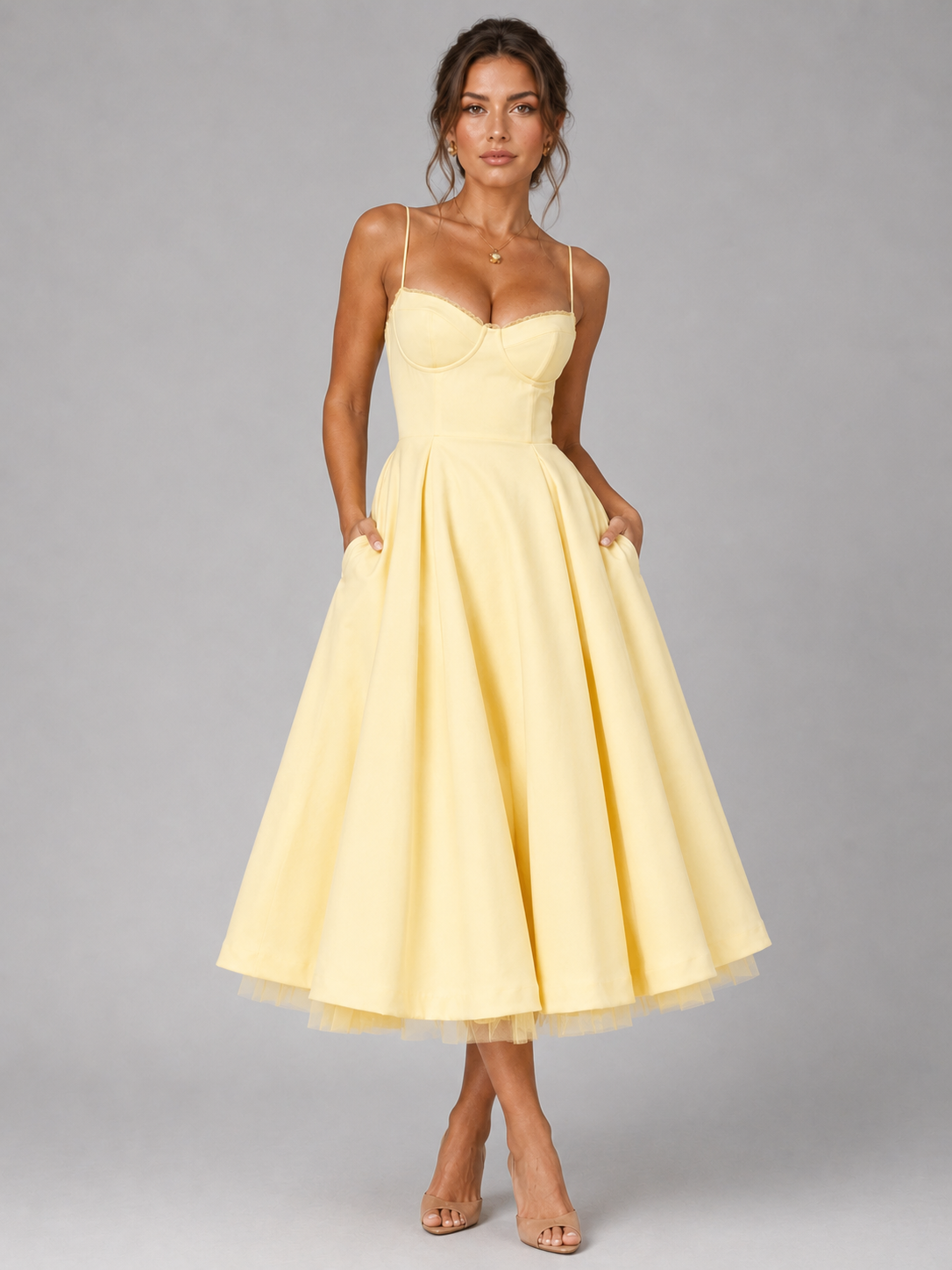 Yellow corset bodice midi dress with sweetheart neckline, thin straps, and full flared skirt.