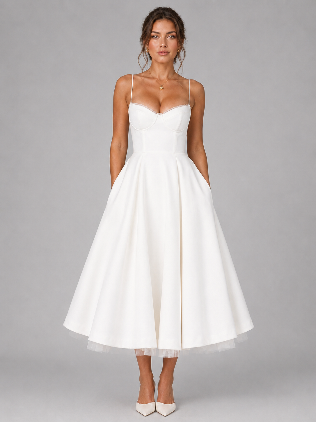 White corset bodice midi dress with sweetheart neckline, thin straps, and full flared skirt.