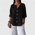 Black women's V-neck button-front blouse, relaxed fit, short sleeves with bronze buttons