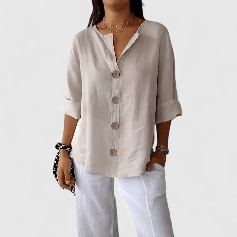 White women's V-neck button-front blouse, relaxed fit, short sleeves with bronze buttons