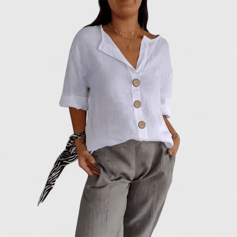 White women's V-neck button-front blouse, relaxed fit, short sleeves with bronze buttons