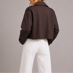 Women's cropped trench jacket, dark brown; rear view with back yoke and cuff tab