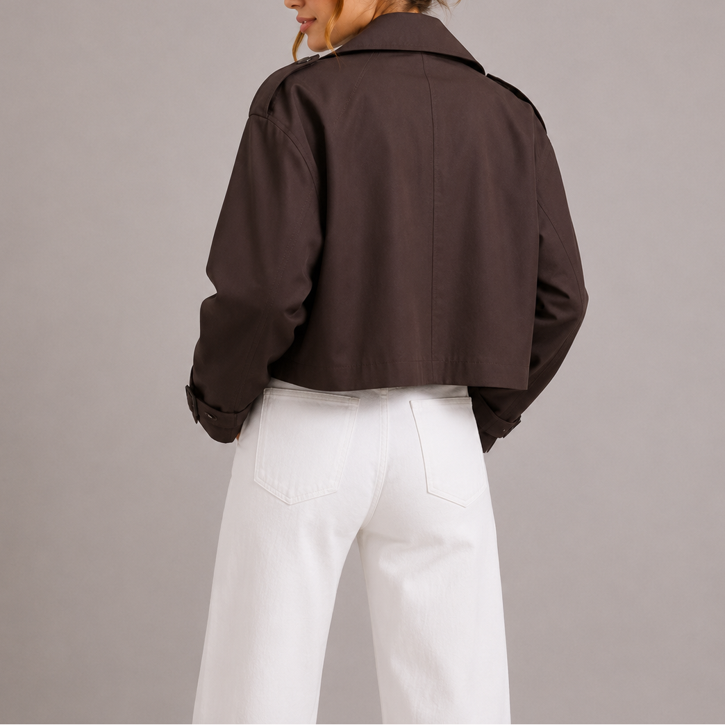 Women's cropped trench jacket, dark brown; rear view with back yoke and cuff tab